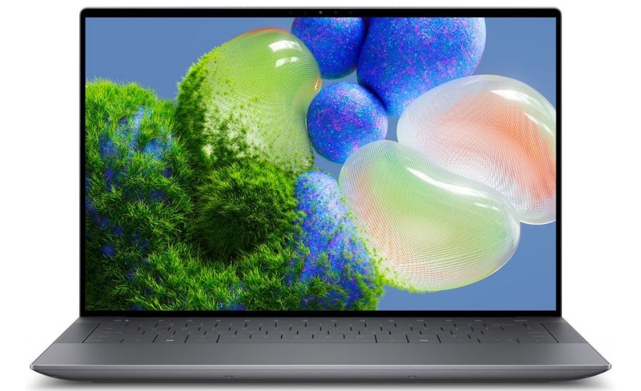 Laptop Dell XPS 14 9440 màu bạc trên bàn làm việc hiện đại, thể hiện thiết kế sang trọng và hiệu năng cao.
