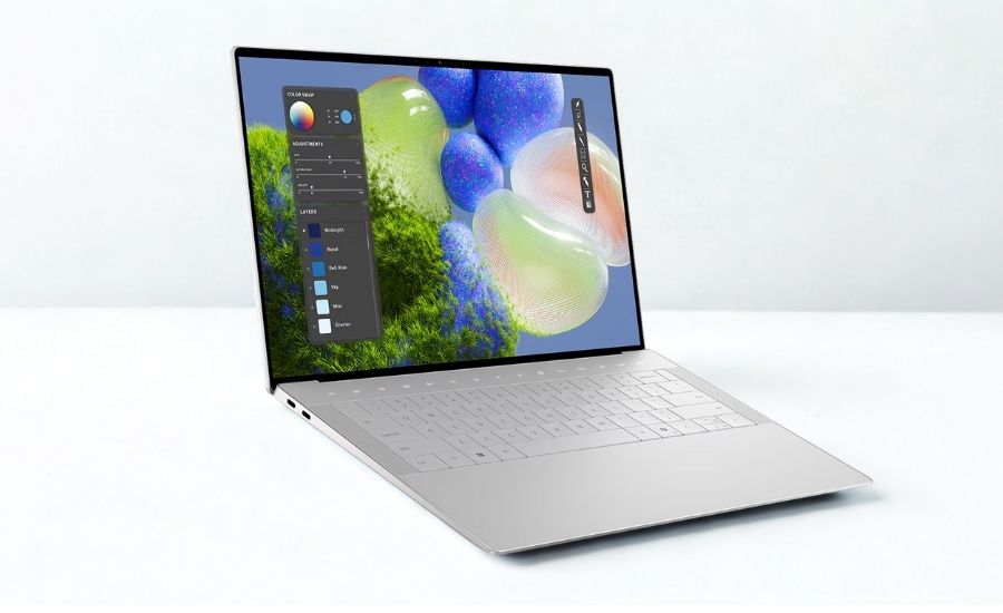 Cận cảnh bàn phím Dell XPS 14 9440 với touchpad kính liền mạch và nút Copilot, thể hiện thiết kế hiện đại và tính năng thông minh.
